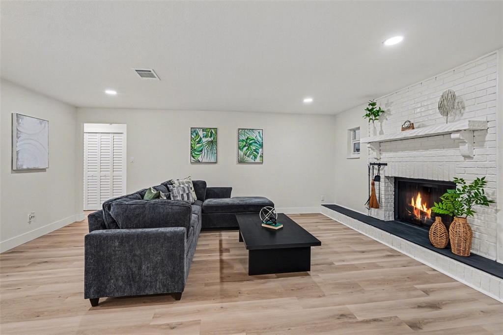 707 Queens Court Seffner, FL 33584 - Photo 8 of 28 a living room with furniture and a fireplace