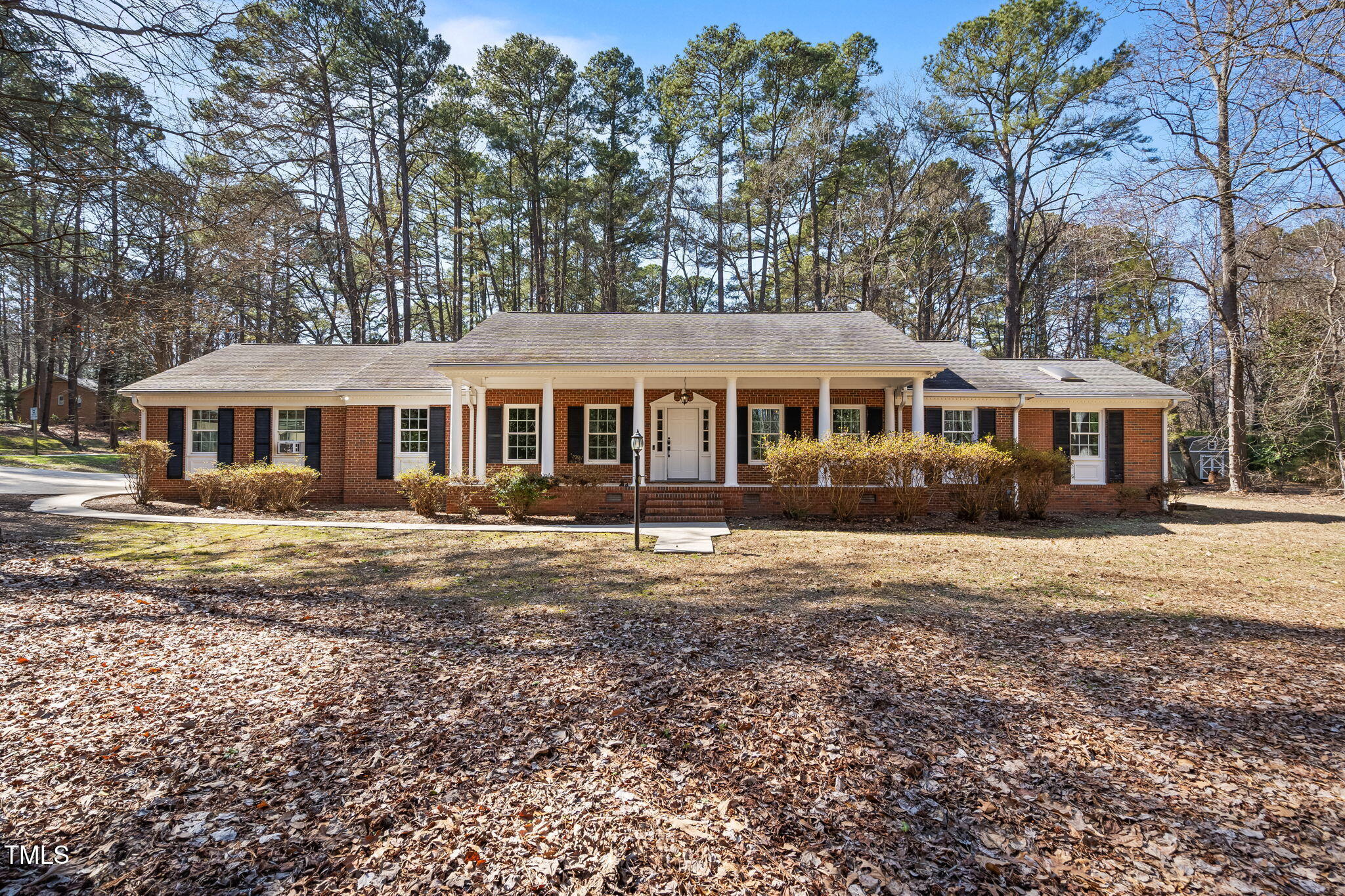 4913 Stillmeadow Road Raleigh, NC 27604 - Photo 1 of 34 a front view of a house with a garden