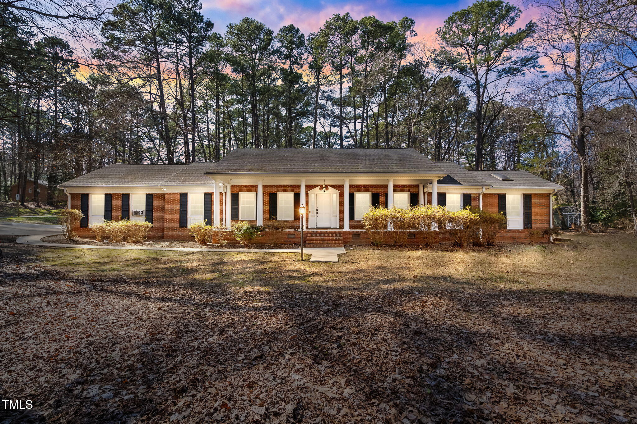 4913 Stillmeadow Road Raleigh, NC 27604 - Photo 2 of 34 a front view of a house with a yard