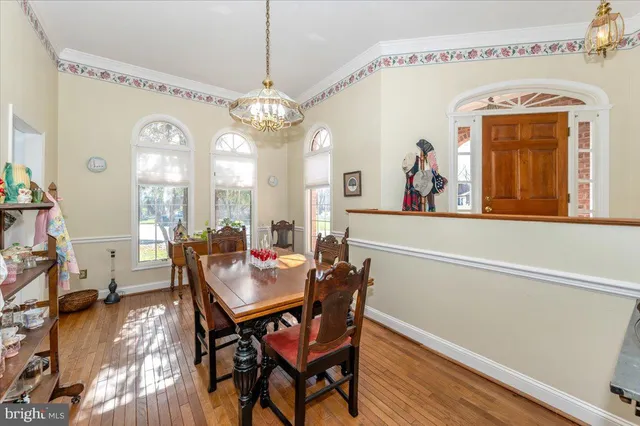 a kitchen with stainless steel appliances kitchen island granite countertop a refrigerator a sink and dishwasher