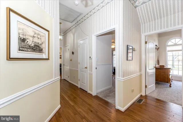 a white bath tub sitting in a bathroom next to a window