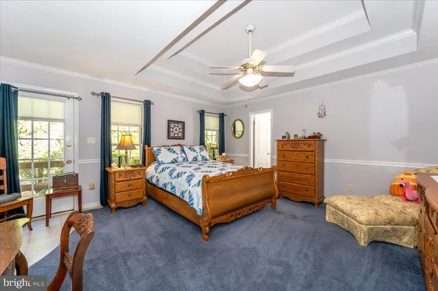 a view of walk in closet with clothes