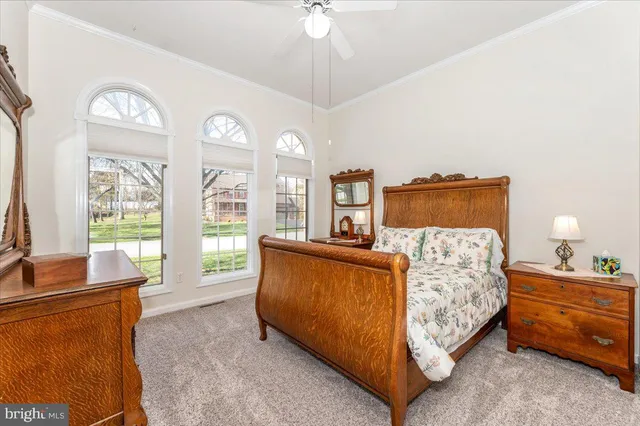 a view of a livingroom with furniture and a workspace