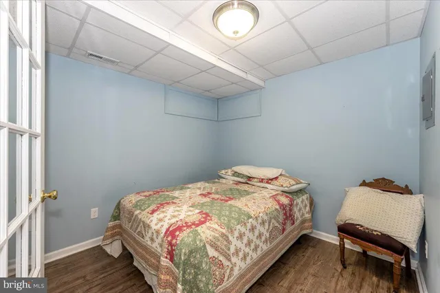 a view of a backyard with a garden and fire pit