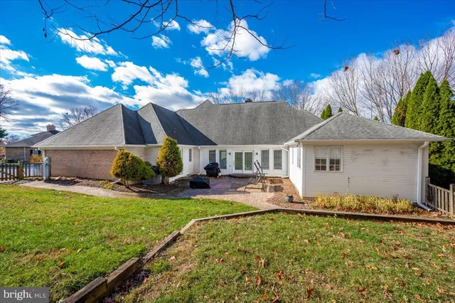 a view of a swimming pool with an outdoor space and seating area