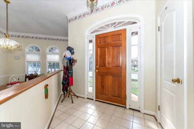 a living room with furniture fireplace and a large window