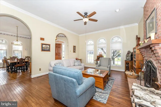 a view of a dining room with furniture and chandelier
