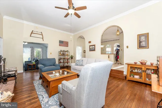 a view of a dining room with furniture and a chandelier