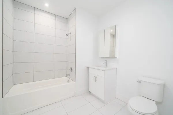 a bathroom with a bathtub toilet and sink