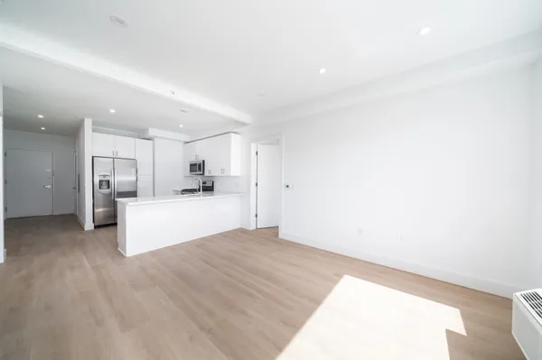 a view of kitchen with wooden floor