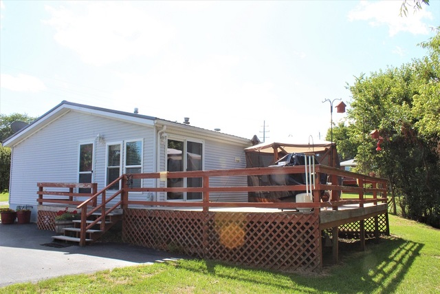 13806 Prairie Center Road Morrison, IL 61270 - Photo 3 of 24 a view of backyard with outdoor seating
