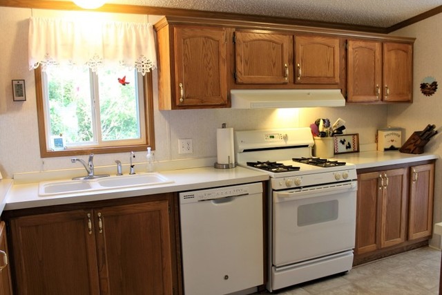 13806 Prairie Center Road Morrison, IL 61270 - Photo 8 of 24 a kitchen with stainless steel appliances granite countertop a sink stove and cabinets