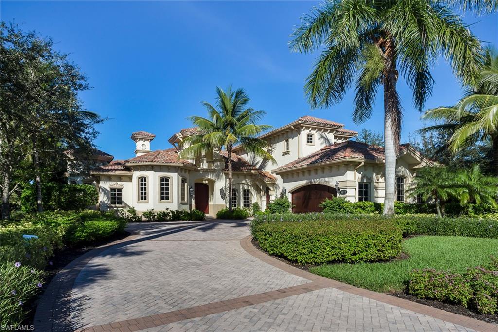 3875 Isla Del Sol Way Naples, FL 34114 - Photo 1 of 24 a front view of a house with a garden
