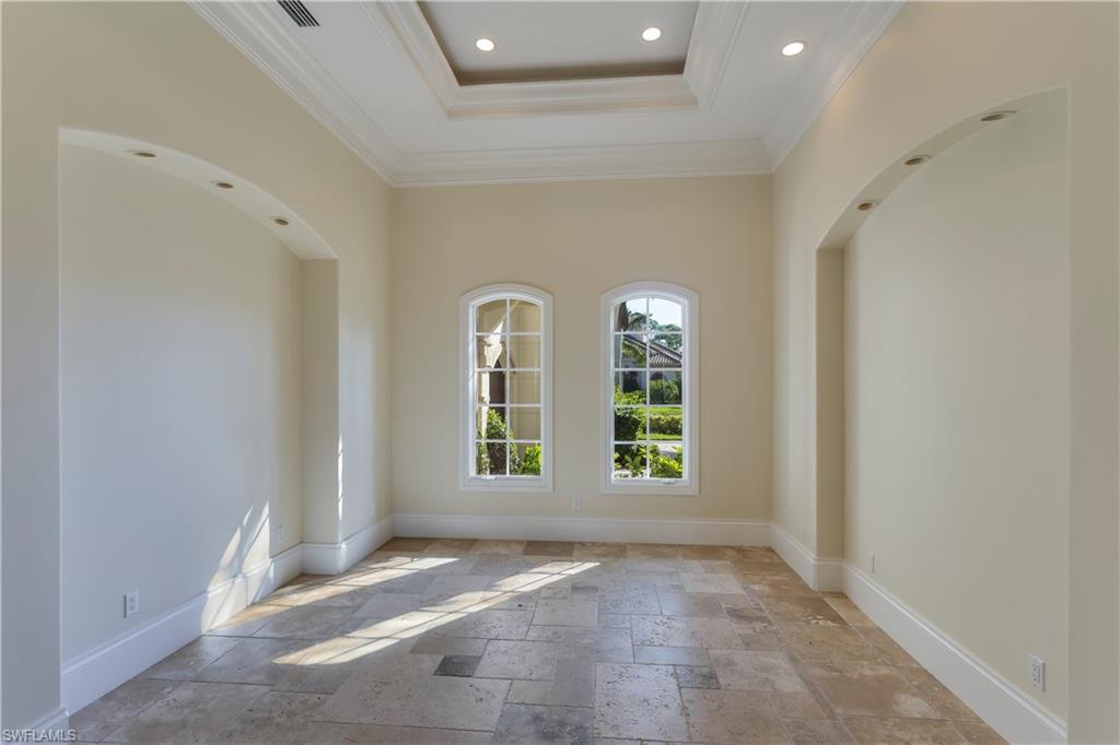 3875 Isla Del Sol Way Naples, FL 34114 - Photo 12 of 24 an empty room with windows and view