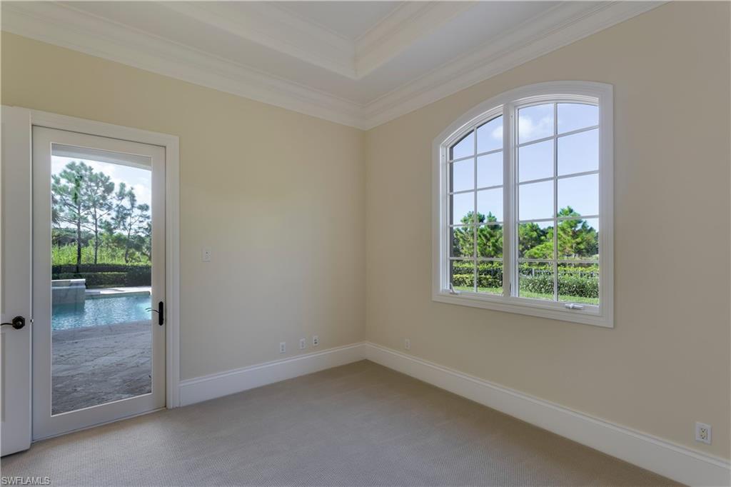 3875 Isla Del Sol Way Naples, FL 34114 - Photo 17 of 24 an empty room with windows