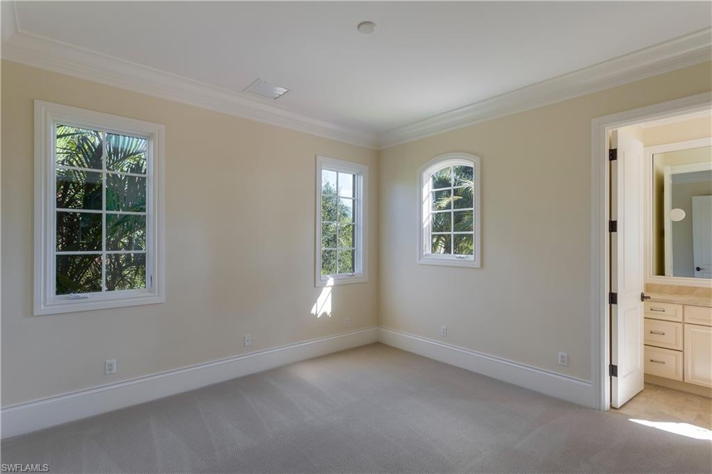 3875 Isla Del Sol Way Naples, FL 34114 - Photo 19 of 24 an empty room with windows