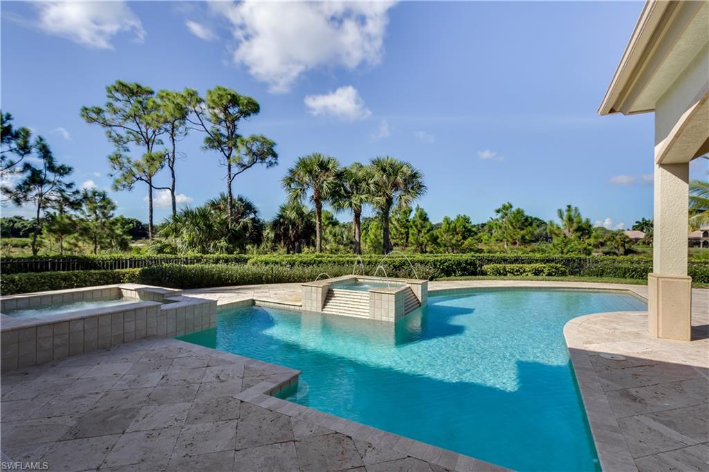 3875 Isla Del Sol Way Naples, FL 34114 - Photo 21 of 24 a view of a swimming pool with a patio