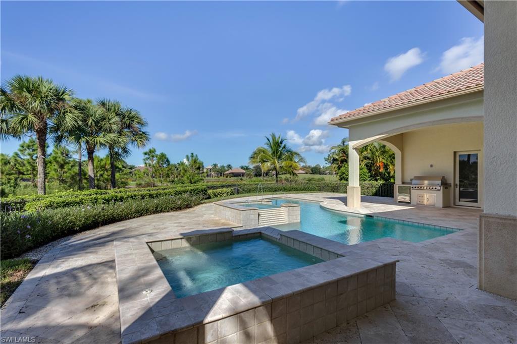 3875 Isla Del Sol Way Naples, FL 34114 - Photo 22 of 24 a view of a swimming pool with a patio