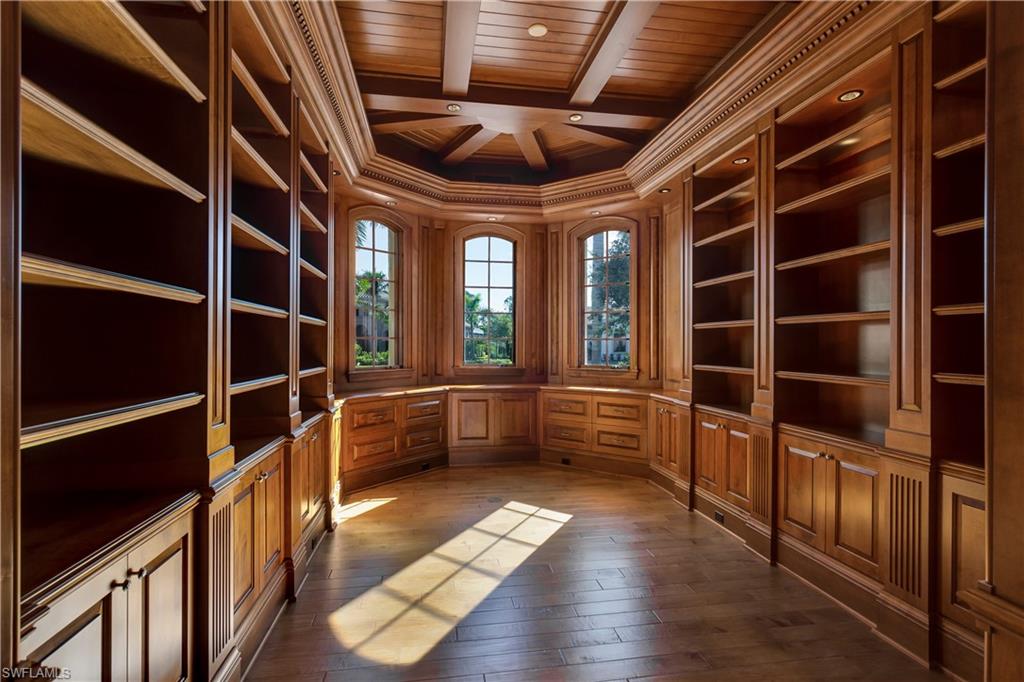 3875 Isla Del Sol Way Naples, FL 34114 - Photo 9 of 24 a view of gallery with wooden floor and windows