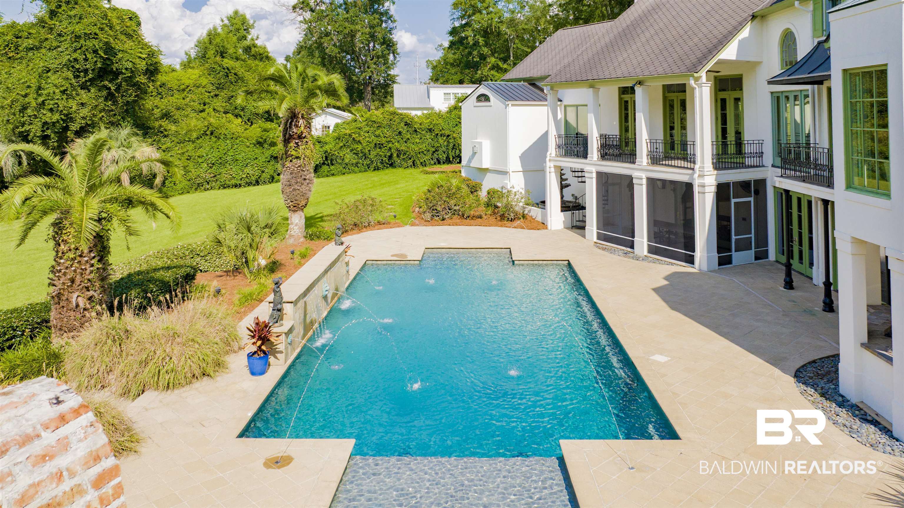 3816 Austill Lane Mobile, AL 36608 - Photo 63 of 80 View of swimming pool featuring a patio area, a yard, an outbuilding, a sunroom, and view of scattered trees