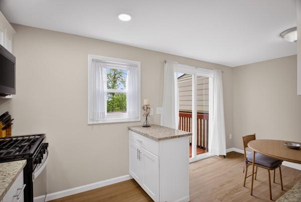 745 Shadycrest Road Pittsburgh, PA 15216 - Photo 16 of 33 Kitchen and Dining and patio door to deck