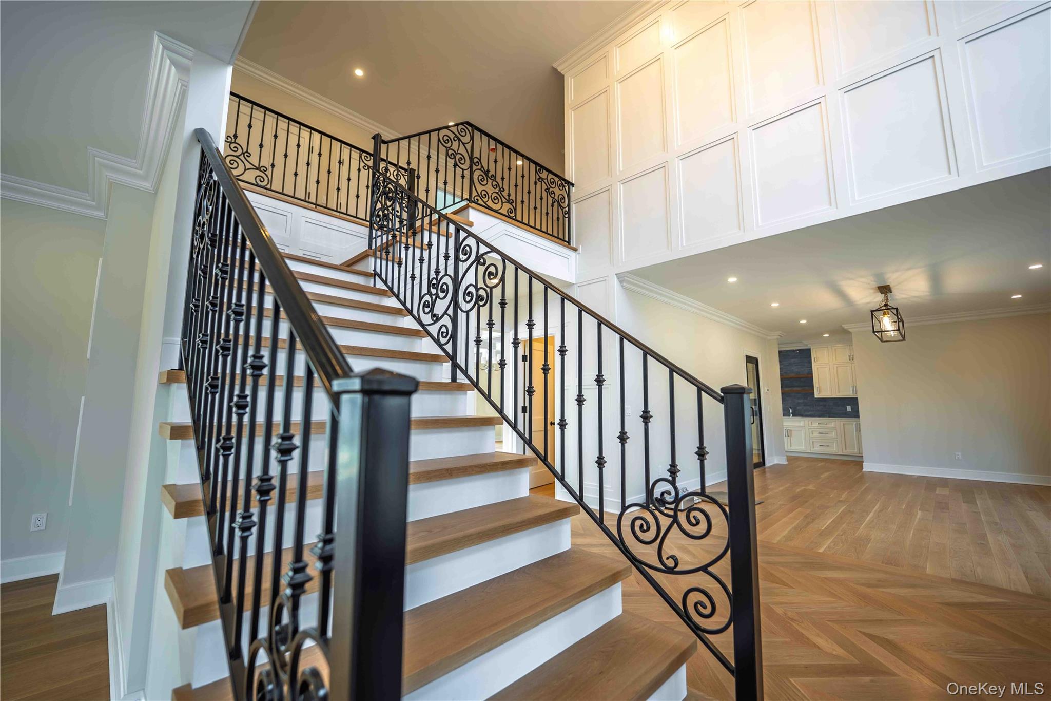 106 Cove Road Asharoken, NY 11768 - Photo 20 of 46 Stairway featuring crown molding, parquet floors, and recessed lighting