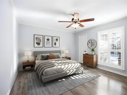 a bedroom with a bed dresser and a window