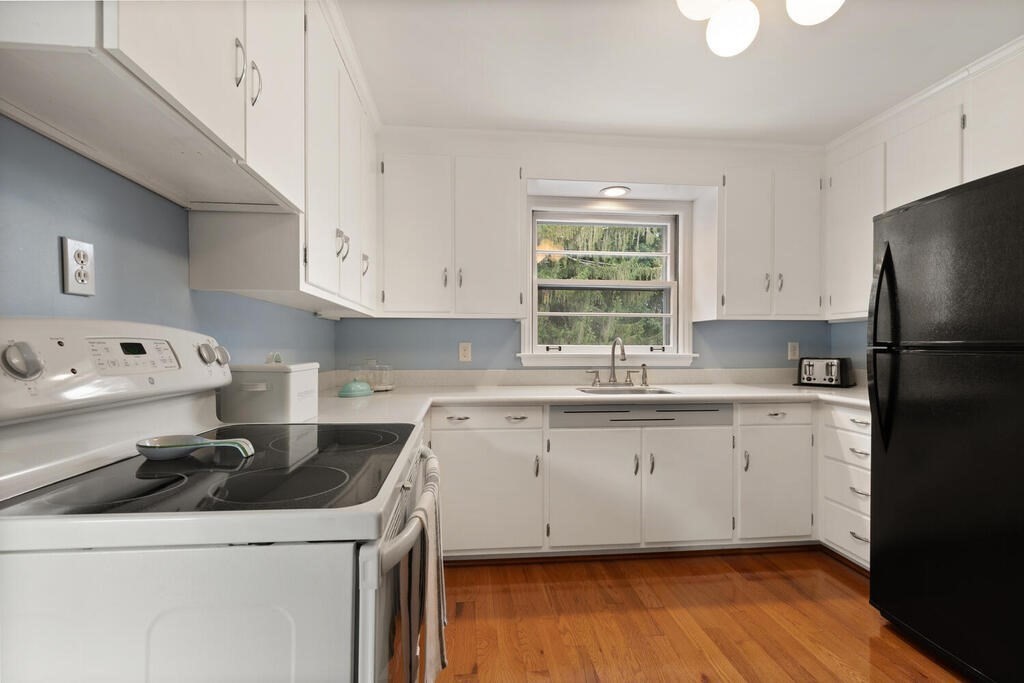 28 Montview Road Chelmsford, MA 01824 - Photo 14 of 38 a kitchen with a sink a stove and cabinets