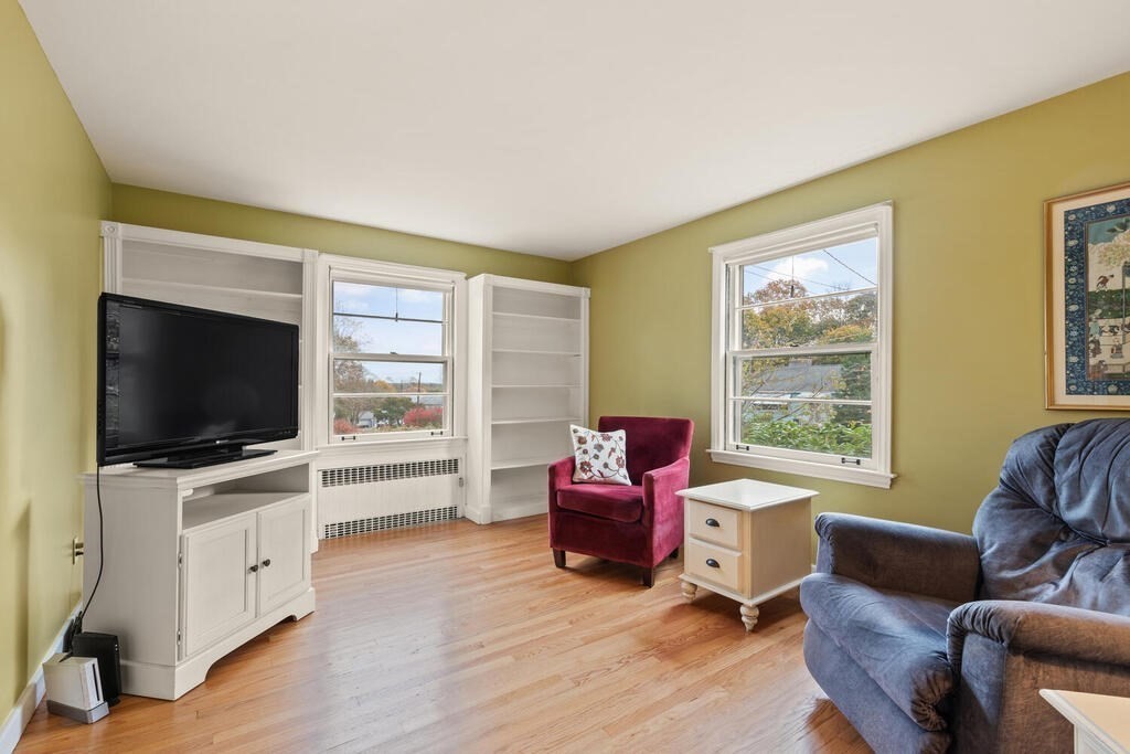 28 Montview Road Chelmsford, MA 01824 - Photo 15 of 38 a living room with furniture and a flat screen tv