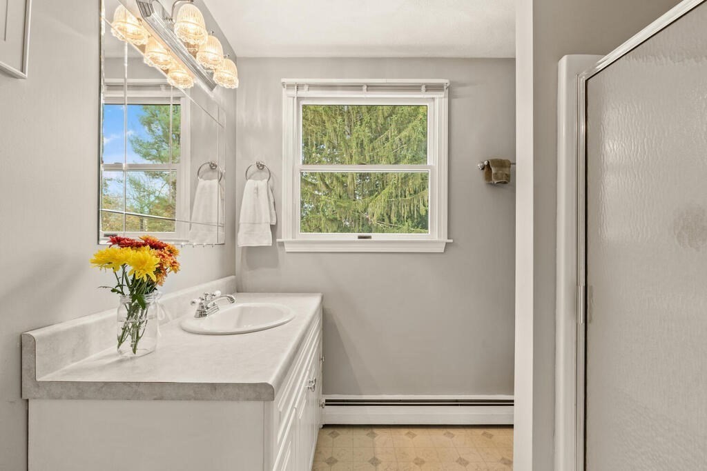 28 Montview Road Chelmsford, MA 01824 - Photo 23 of 38 a bath room with a sink furniture and a window