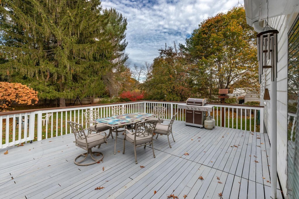 28 Montview Road Chelmsford, MA 01824 - Photo 36 of 38 a view of a chair and table on the wooden deck