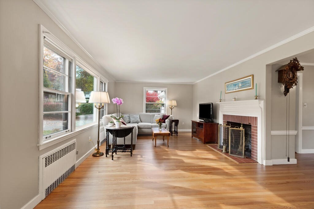 28 Montview Road Chelmsford, MA 01824 - Photo 5 of 38 a living room with furniture a fireplace and wooden floor