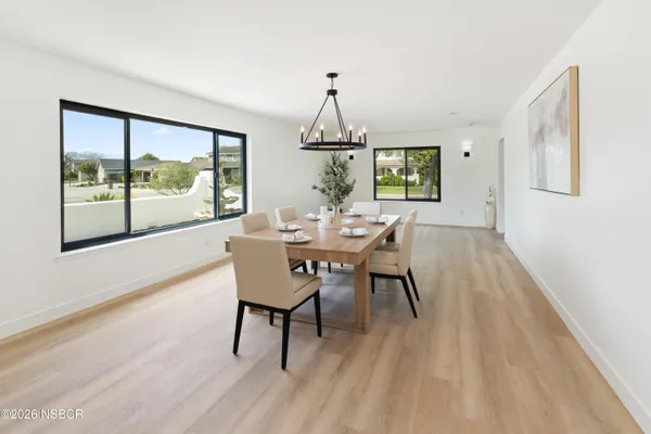 a dining room with furniture window wooden floor