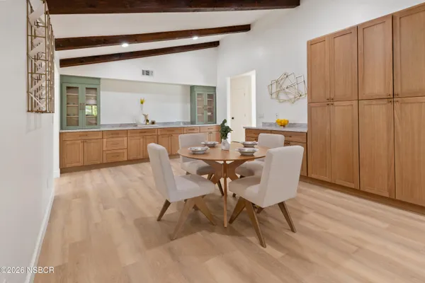 a dining room with furniture and window