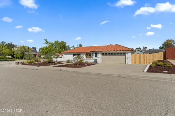 a view of multiple houses with a street
