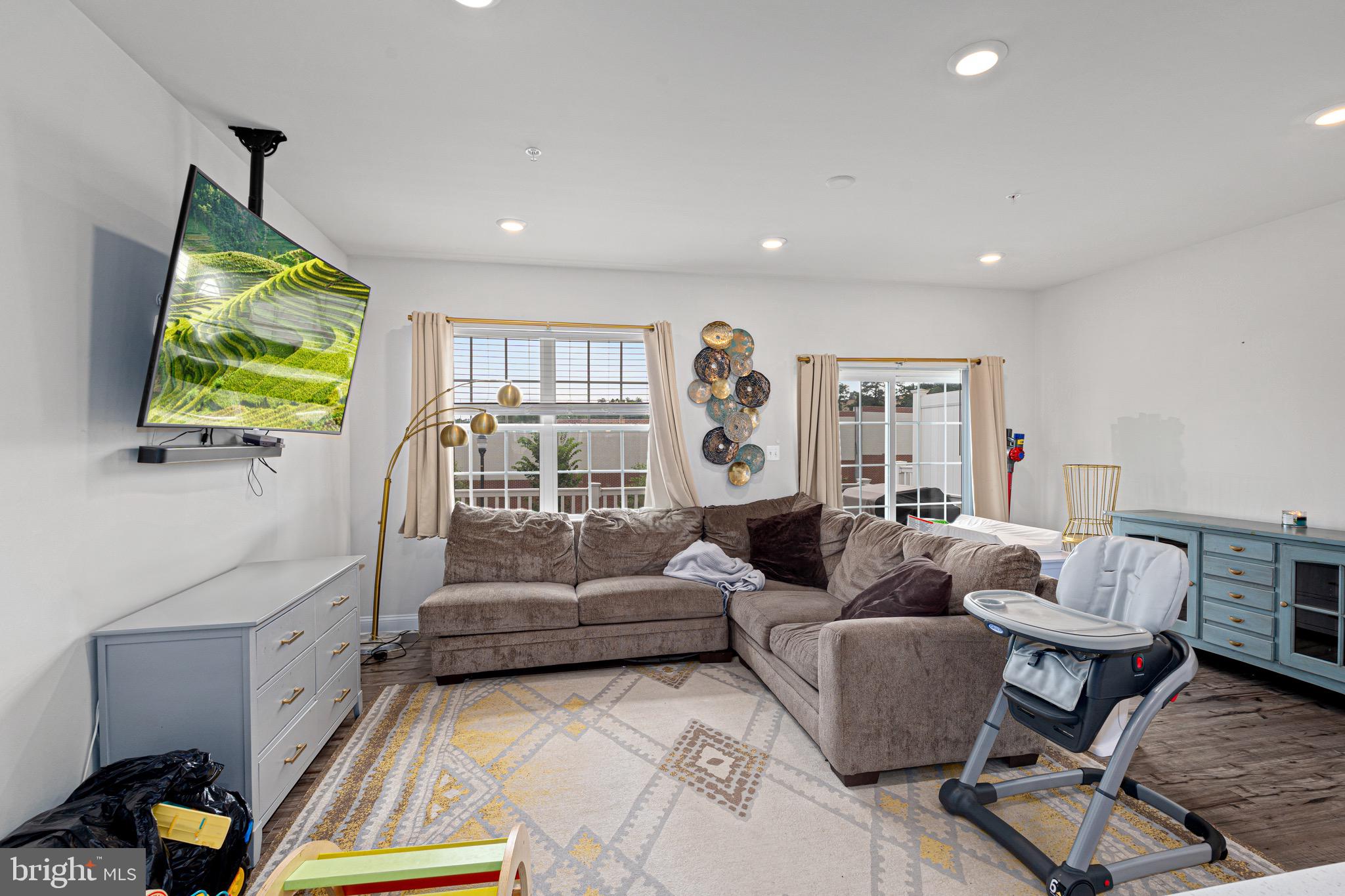 7583 Marston Way Hanover, MD 21076 - Photo 12 of 36 a living room with furniture and a flat screen tv