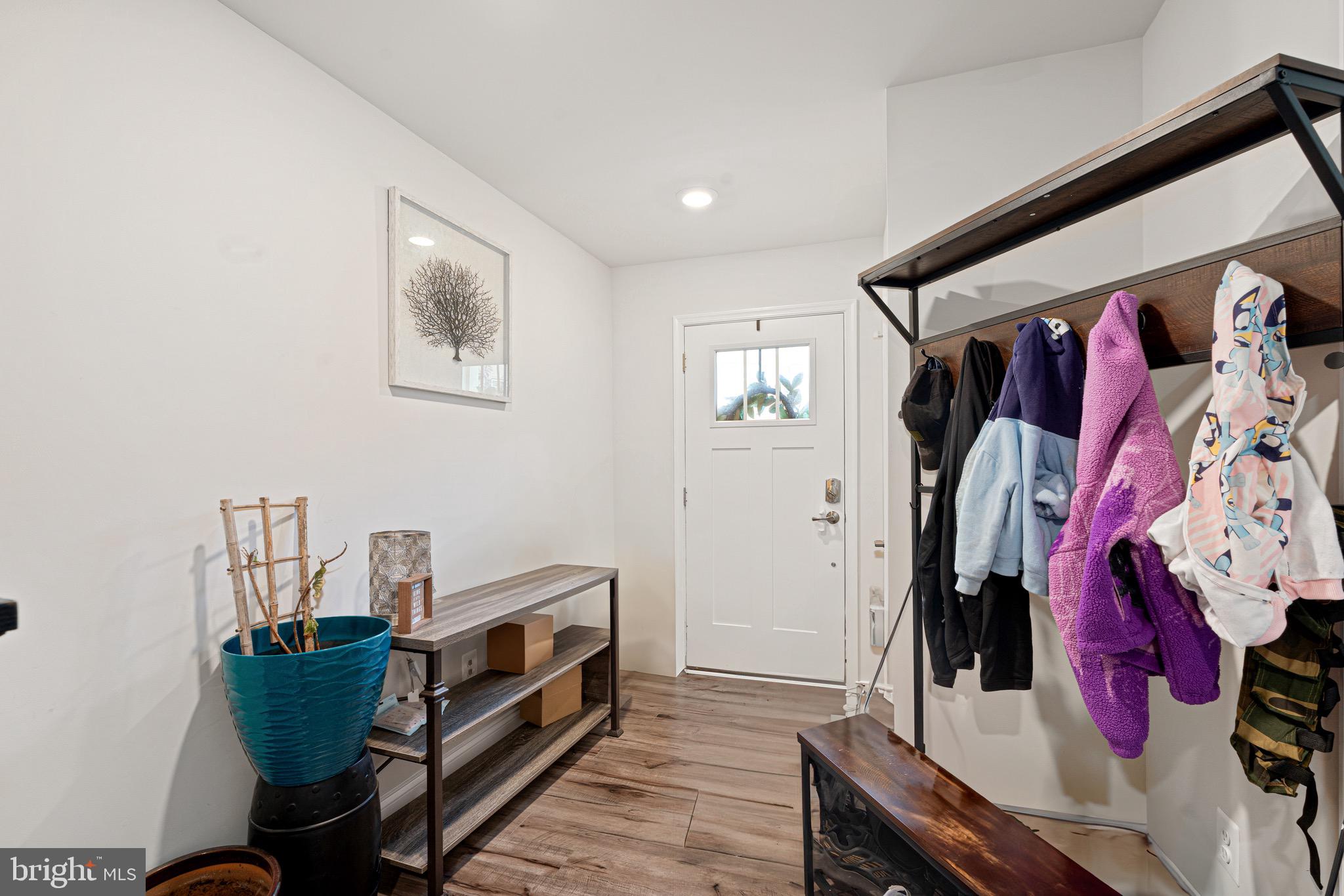 7583 Marston Way Hanover, MD 21076 - Photo 13 of 36 a living room with furniture and a bed