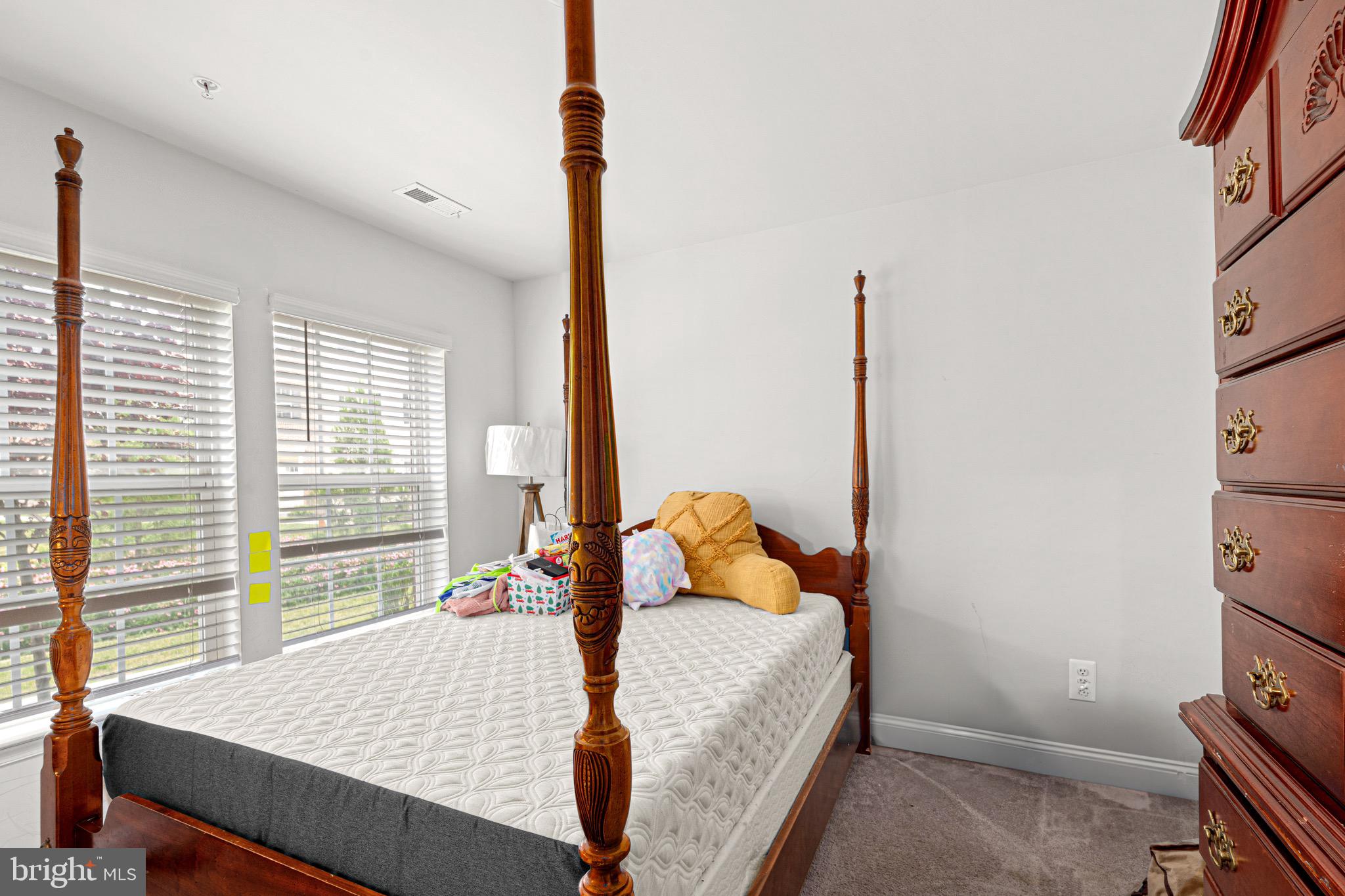 7583 Marston Way Hanover, MD 21076 - Photo 14 of 36 a bedroom with a bed and a window