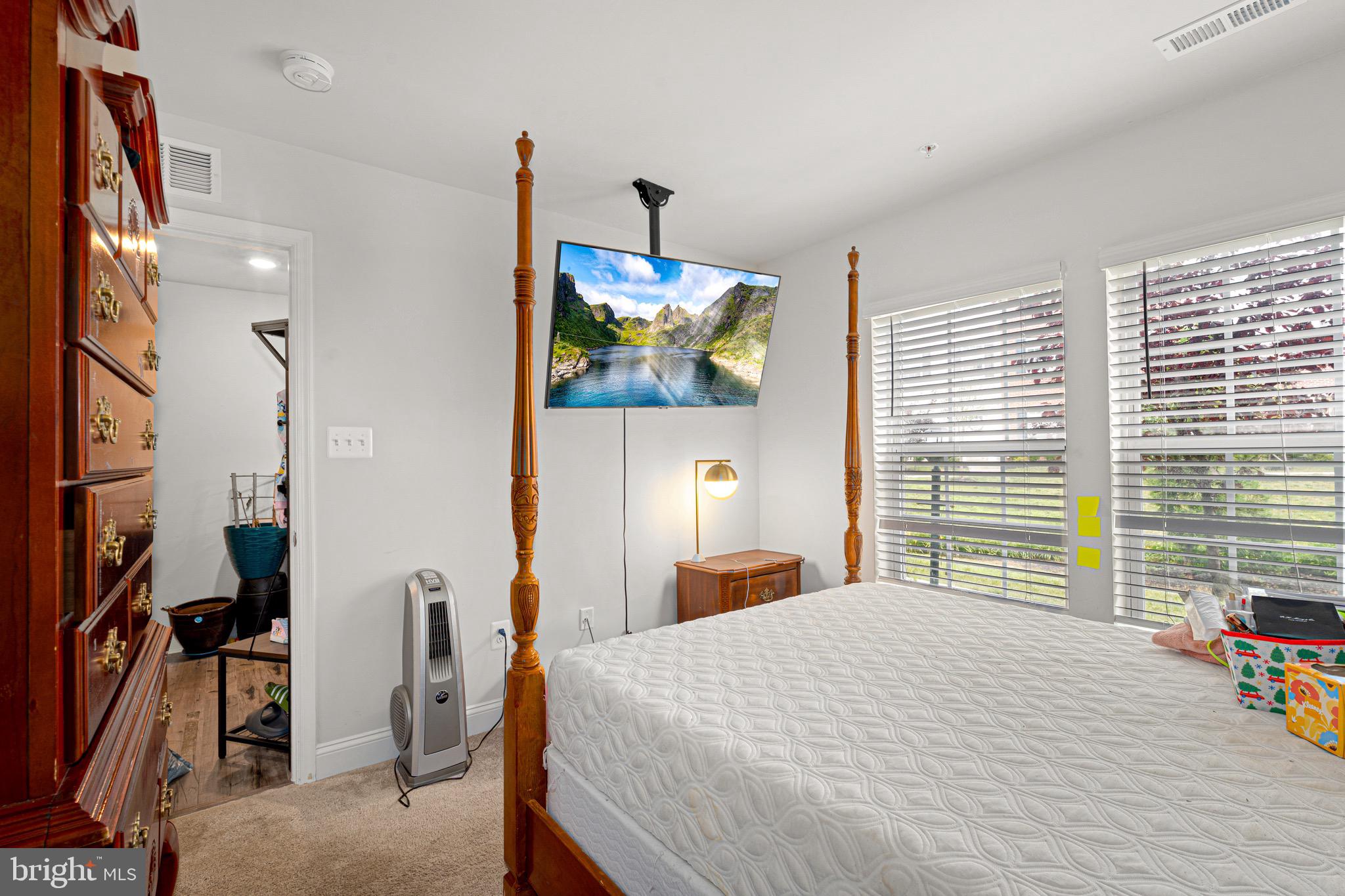 7583 Marston Way Hanover, MD 21076 - Photo 15 of 36 a bedroom with a bed a window and walk in closet