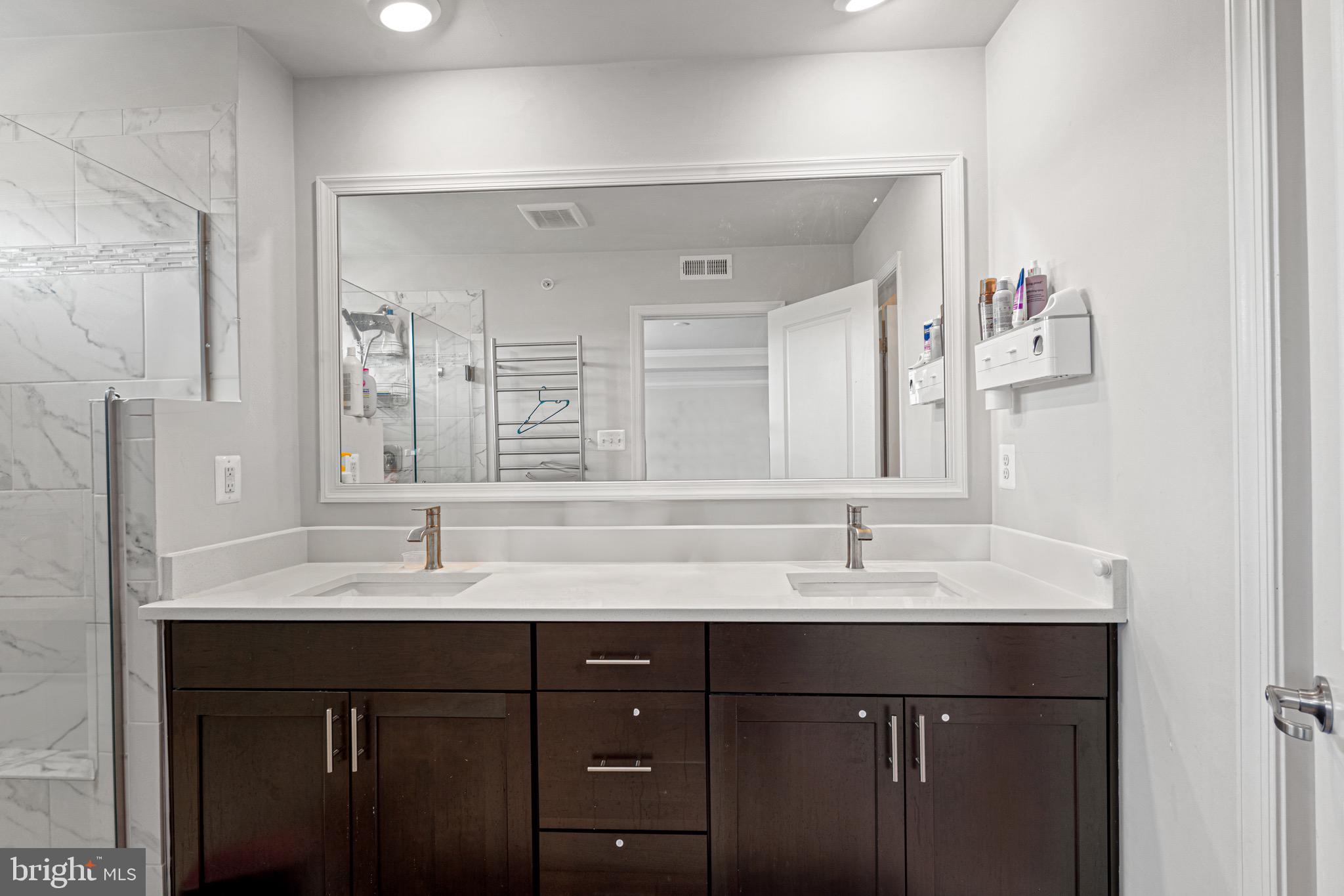 7583 Marston Way Hanover, MD 21076 - Photo 23 of 36 a bathroom with a sink vanity and a mirror