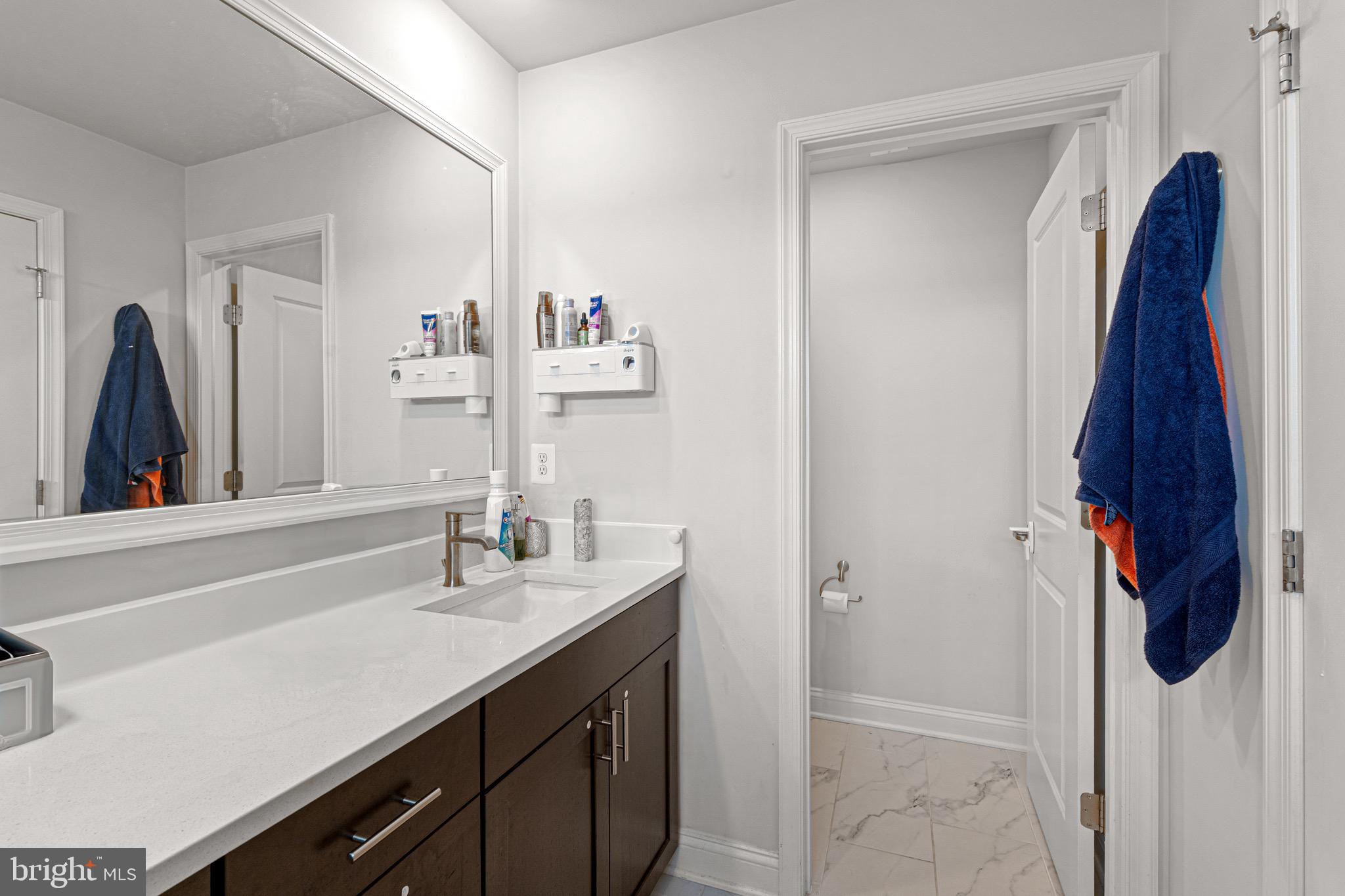 7583 Marston Way Hanover, MD 21076 - Photo 25 of 36 a bathroom with a sink vanity and a mirror