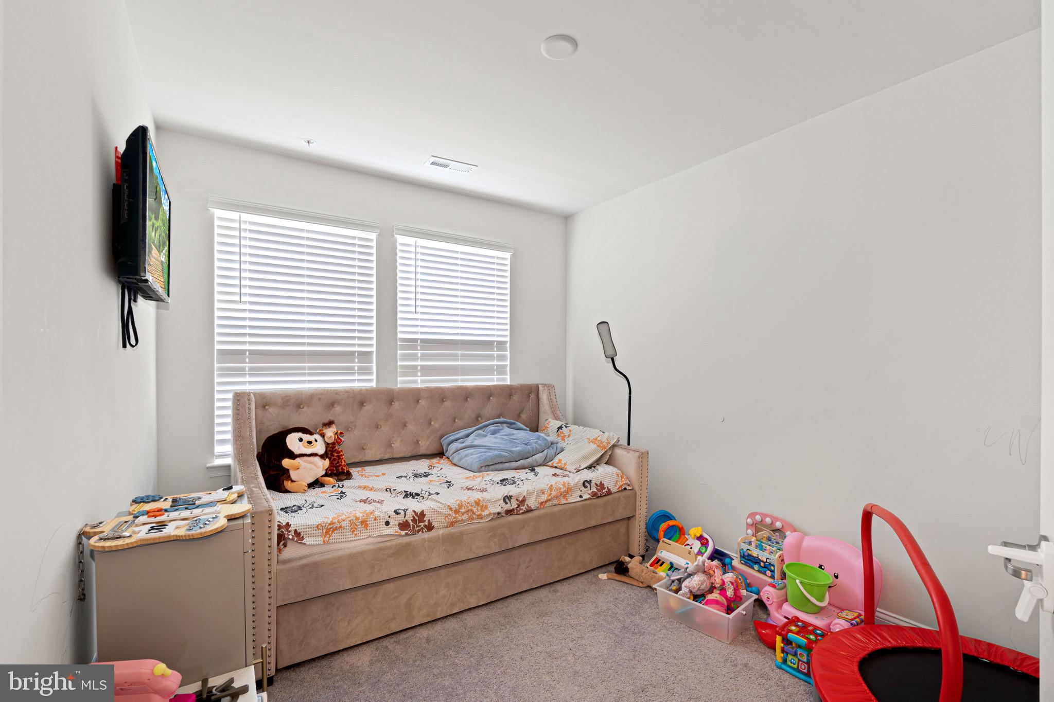 7583 Marston Way Hanover, MD 21076 - Photo 26 of 36 a living room with furniture and a flat screen tv