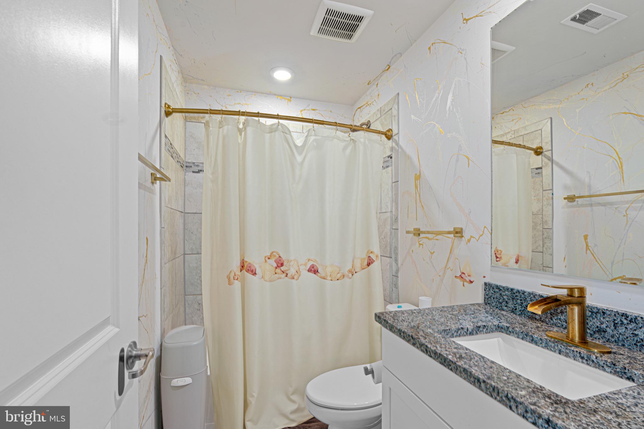 7583 Marston Way Hanover, MD 21076 - Photo 30 of 36 a bathroom with a granite countertop sink toilet and shower