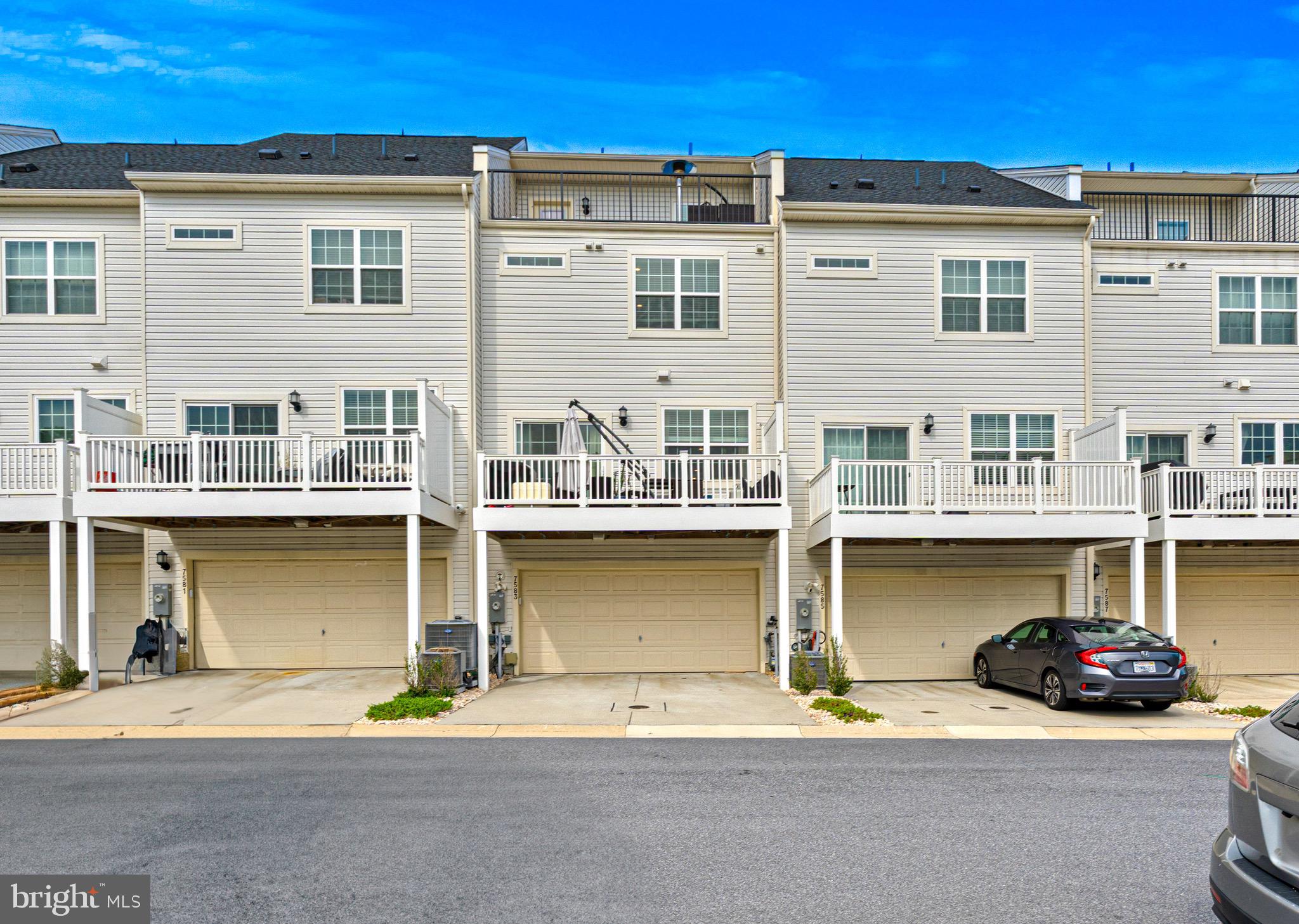 7583 Marston Way Hanover, MD 21076 - Photo 4 of 36 a front view of a house with lots of windows