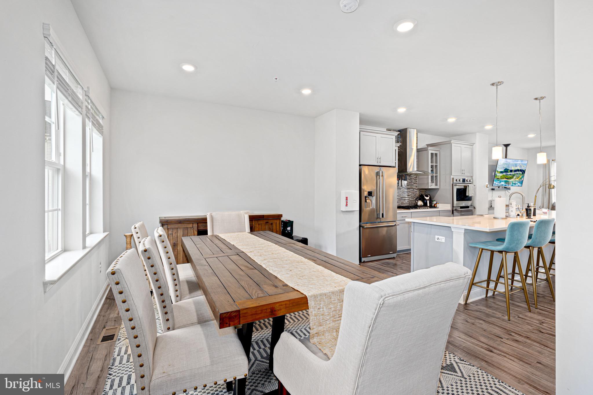 7583 Marston Way Hanover, MD 21076 - Photo 9 of 36 a kitchen with a table and chairs