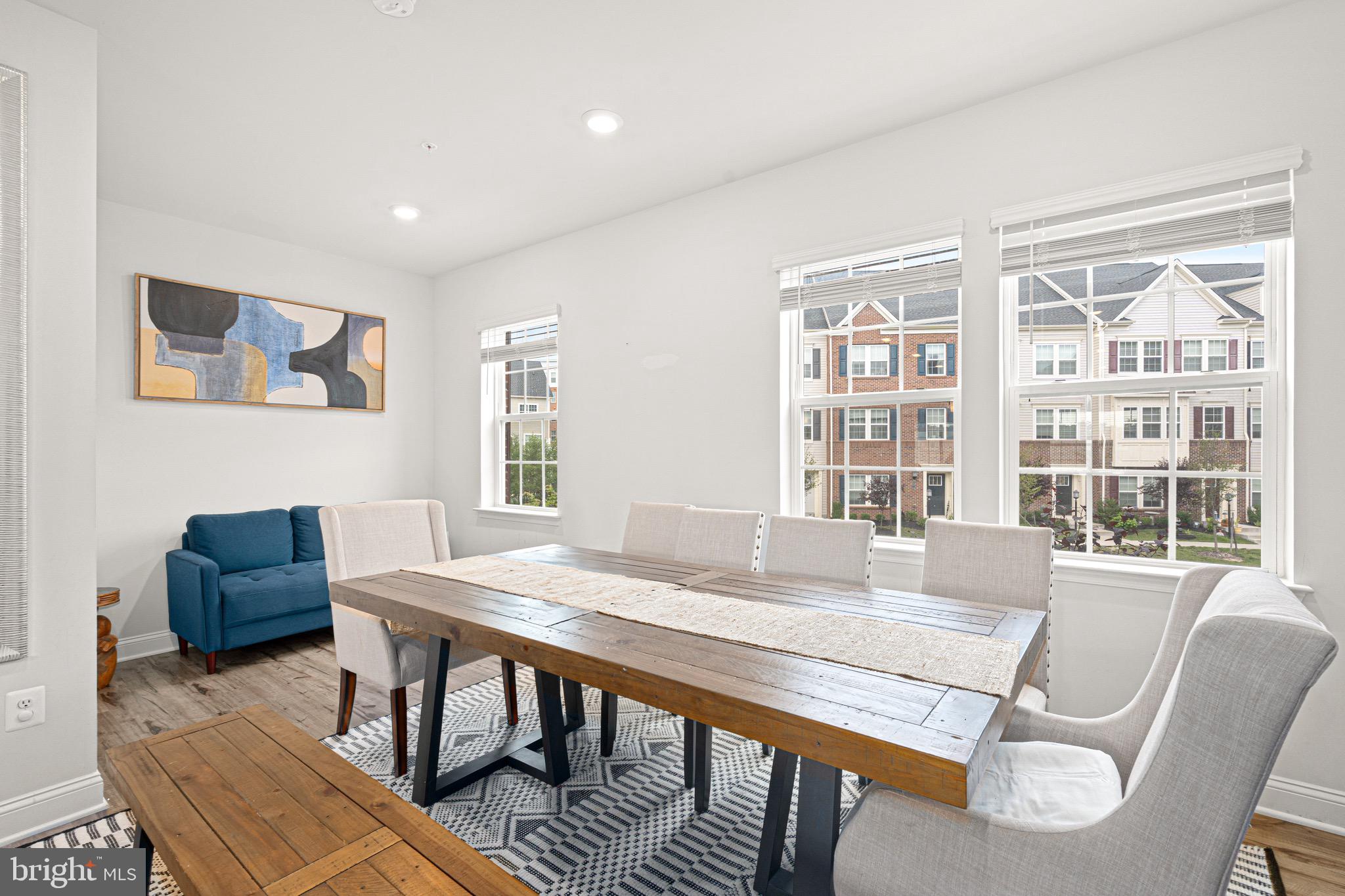 7583 Marston Way Hanover, MD 21076 - Photo 10 of 36 a view of a dining room with furniture window and wooden floor