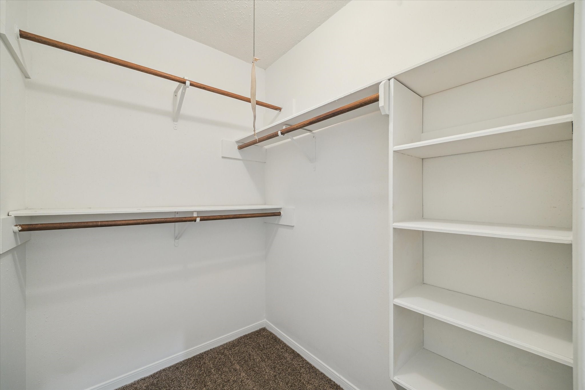 2717 Parrott Avenue Rosenberg, TX 77471 - Photo 14 of 20 a view of an empty walk in closet