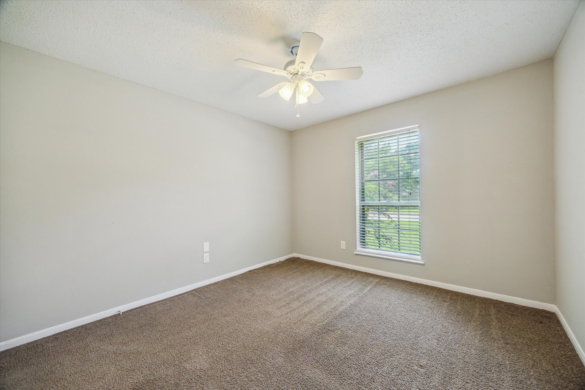 2717 Parrott Avenue Rosenberg, TX 77471 - Photo 17 of 20 an empty room with fan and windows