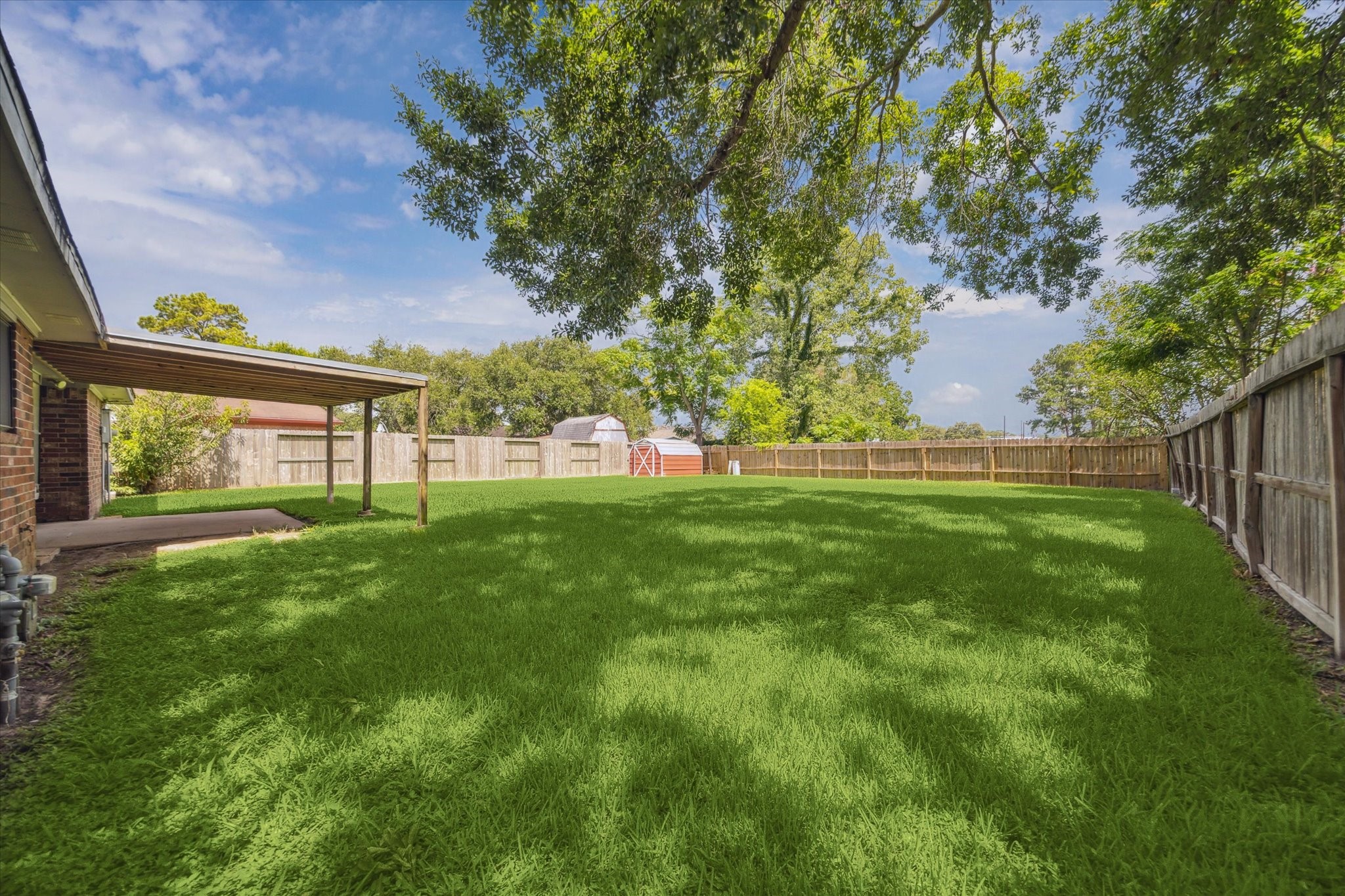 2717 Parrott Avenue Rosenberg, TX 77471 - Photo 19 of 20 a view of green field with trees in the background