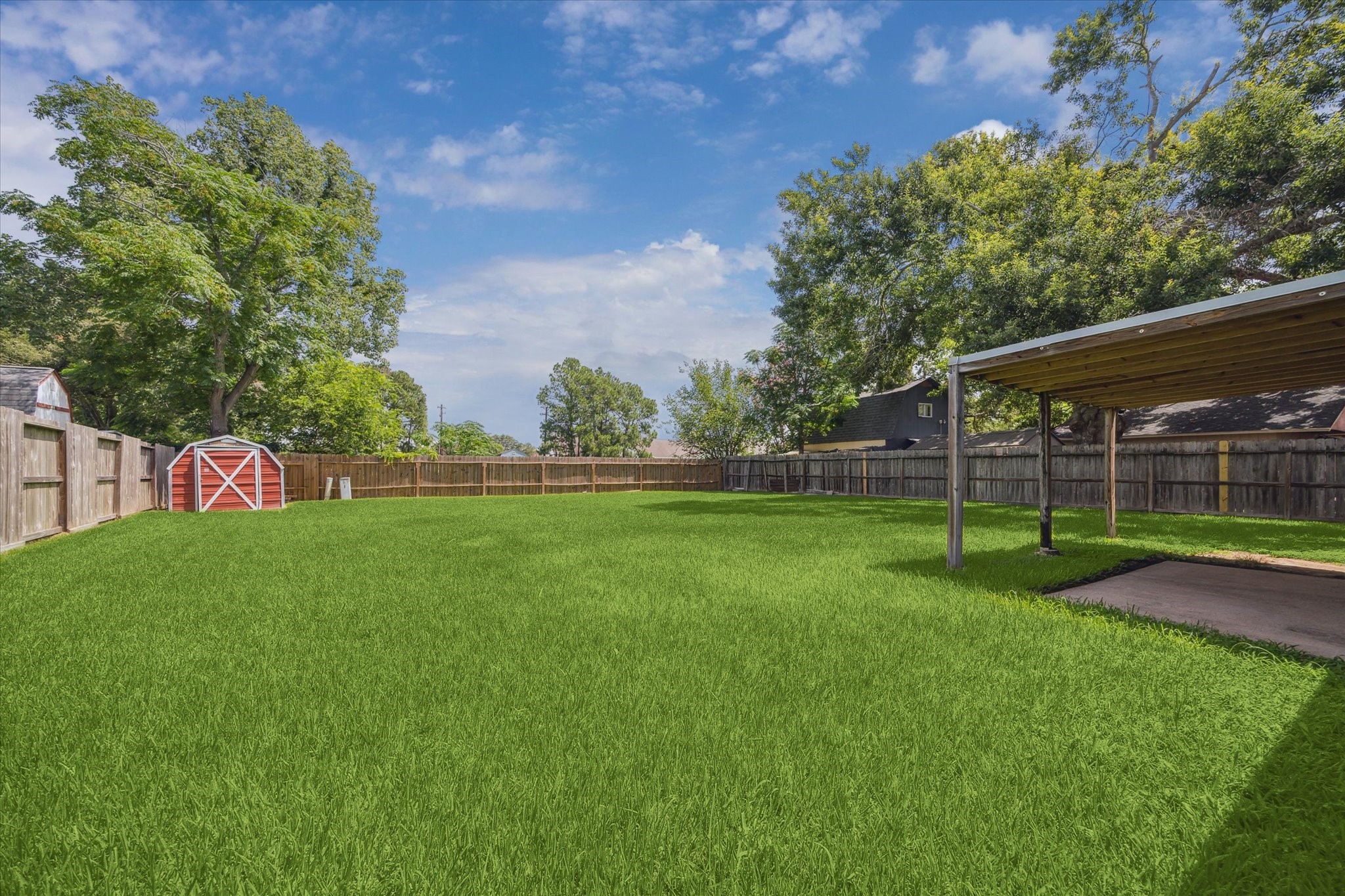 2717 Parrott Avenue Rosenberg, TX 77471 - Photo 20 of 20 a view of a park with plants and a large tree